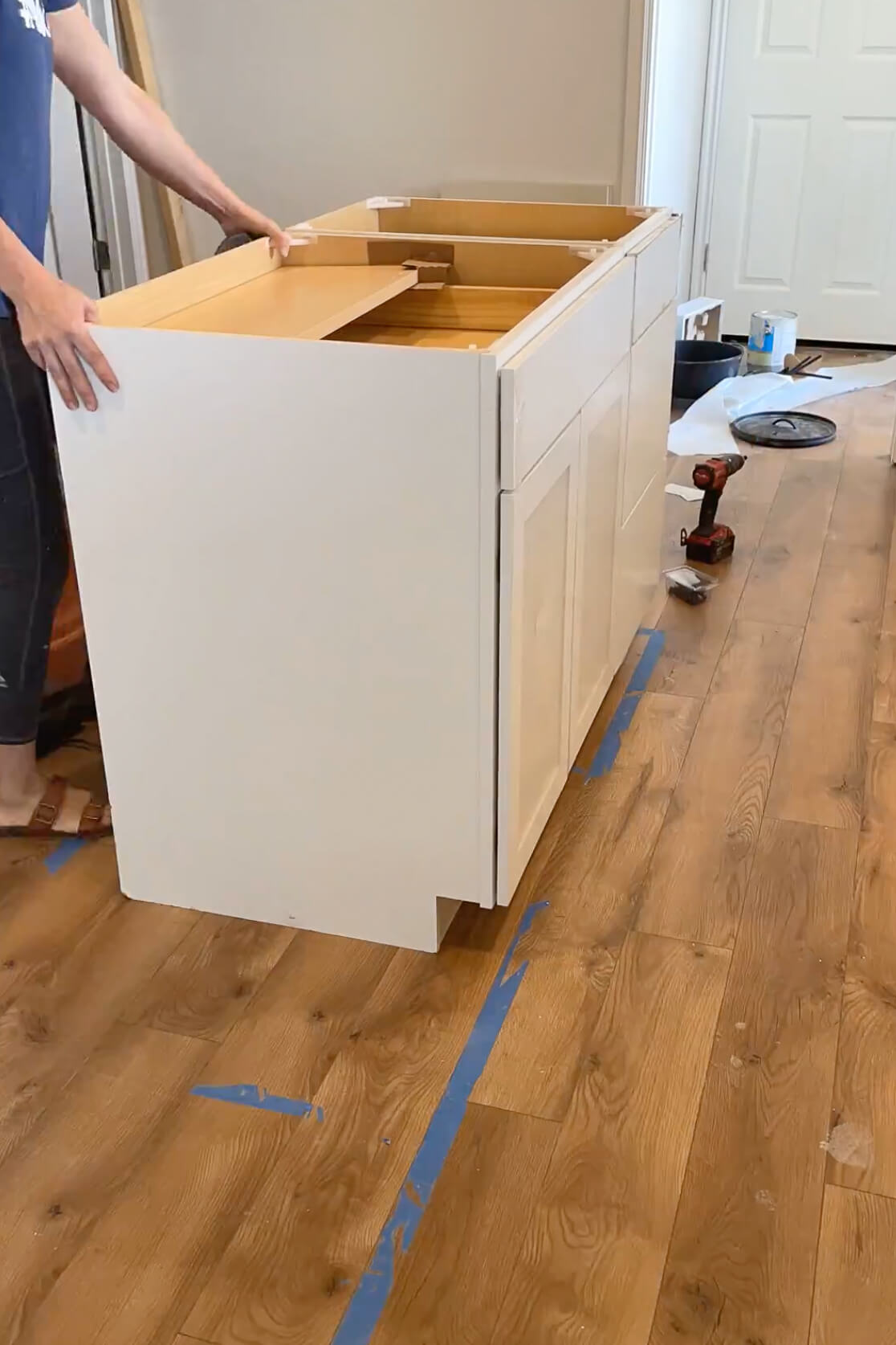 Installing a waterfall kitchen island over a laminate floor.